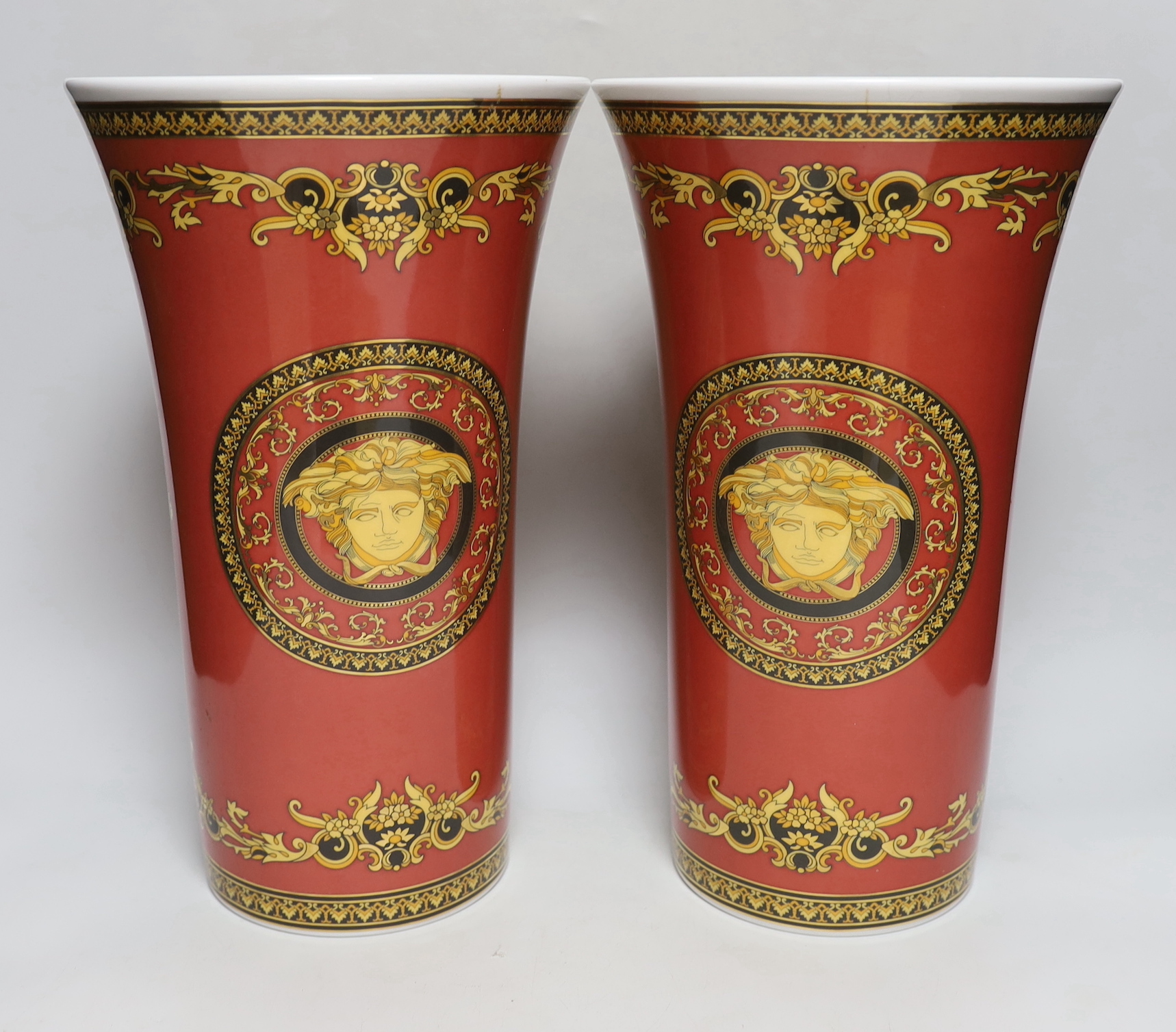 A large pair of Rosenthal Versace Medusa pattern vases, 34cm tall
